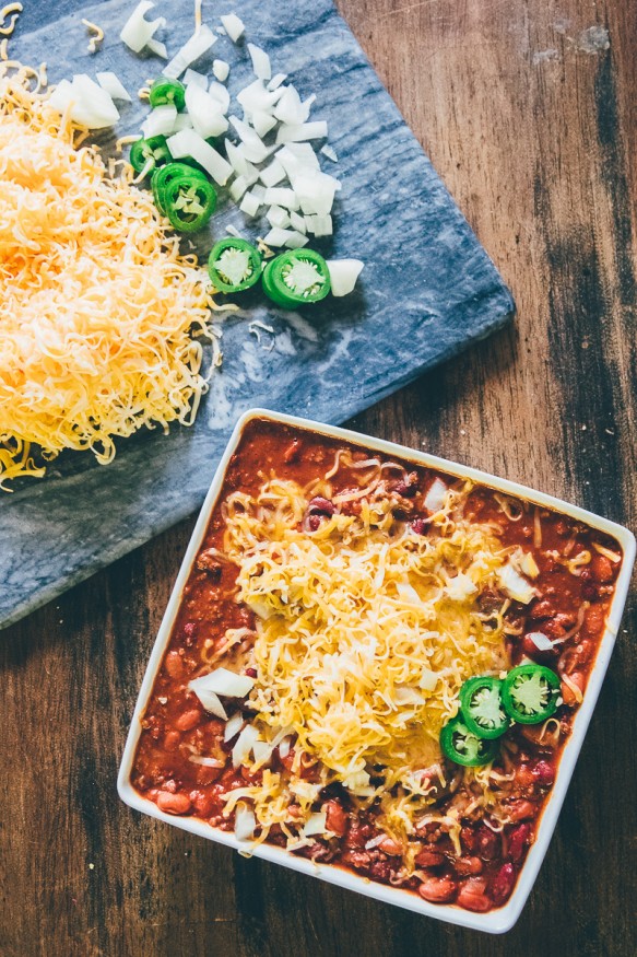 Slow cooked Chili with Ground beef tomatoes, beans and jalapenos and a spicy seasoning, This batch of chili is a great weeknight dinner!