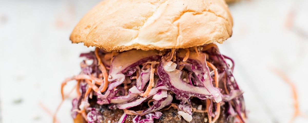 Bacon Bleu Cheese Cole Slaw Burger - A red cabage coleslaw topped on a half pound juicy burger. Amazing way to change up your burger night! dadwithapan.com