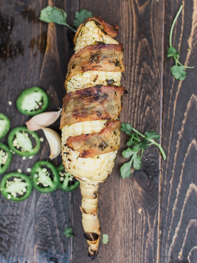 Bacon Wrapped Corn with a Jalapeno and Cilantro blend that will take your summer grilling to the next level! Full of flavor and spiciness! dadwithapan.com