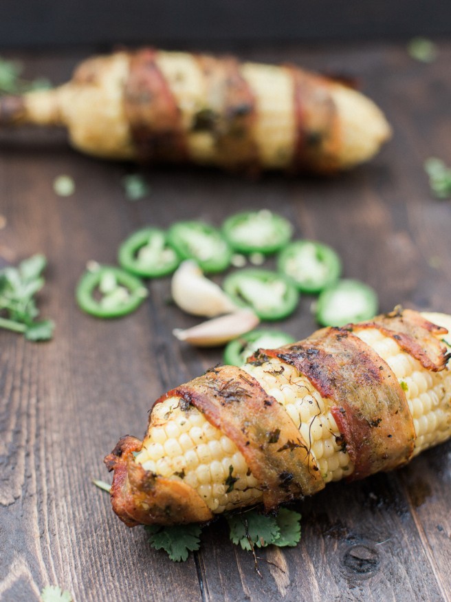 Bacon Wrapped Corn with a Jalapeno and Cilantro blend that will take your summer grilling to the next level! Full of flavor and spiciness! dadwithapan.com