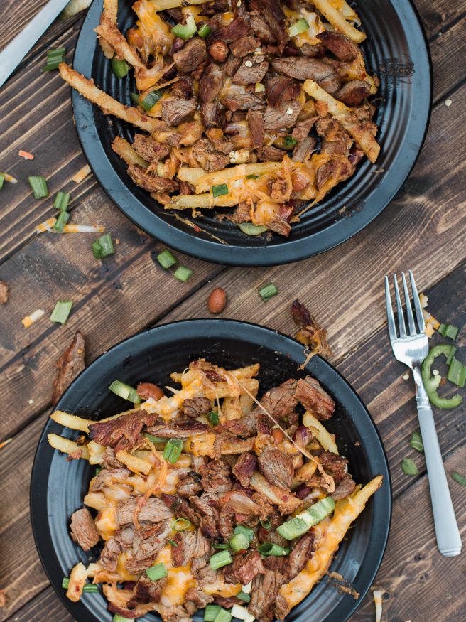 Carne Asada Fries with Chili and cheese! The best combination in the world and it's going to be a crowd pleaser. Perfect for entertaining!