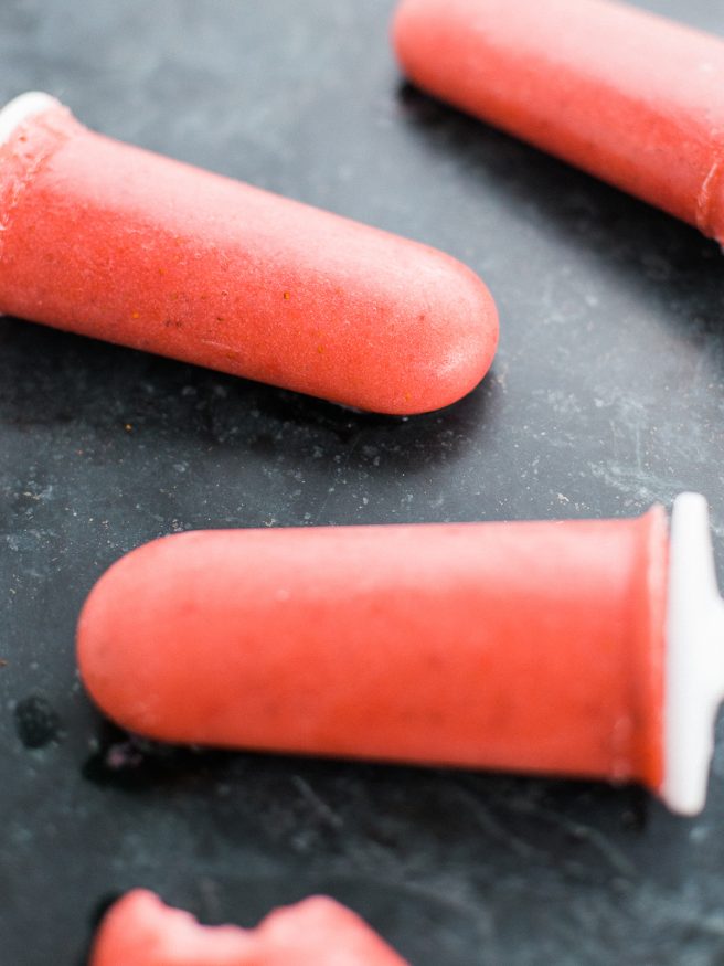 Popsicles with banana ice cream, strawberries, and coconut almond milk. Guiltless and perfect for a hot summer day! 