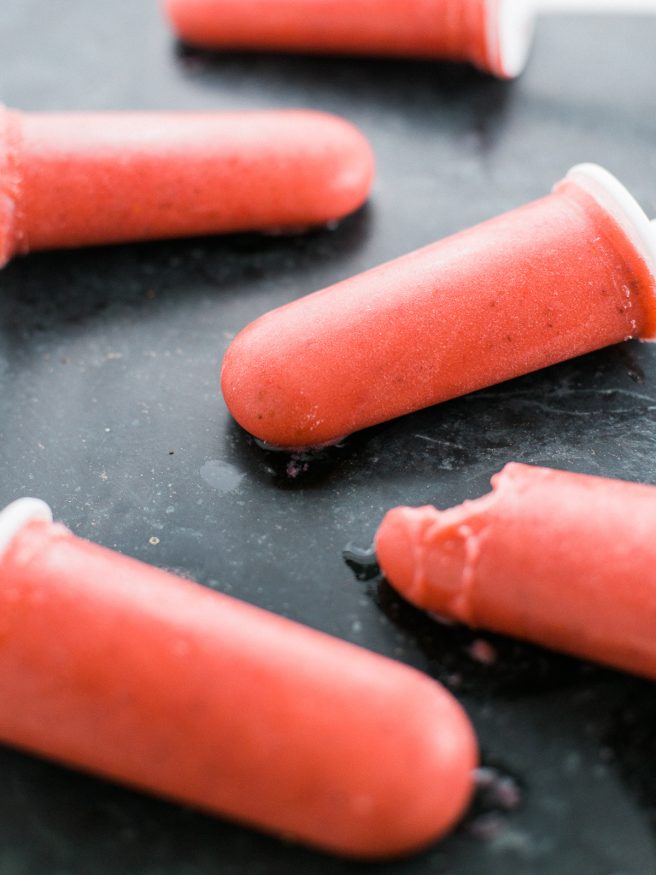 Popsicles with banana ice cream, strawberries, and coconut almond milk. Guiltless and perfect for a hot summer day! 