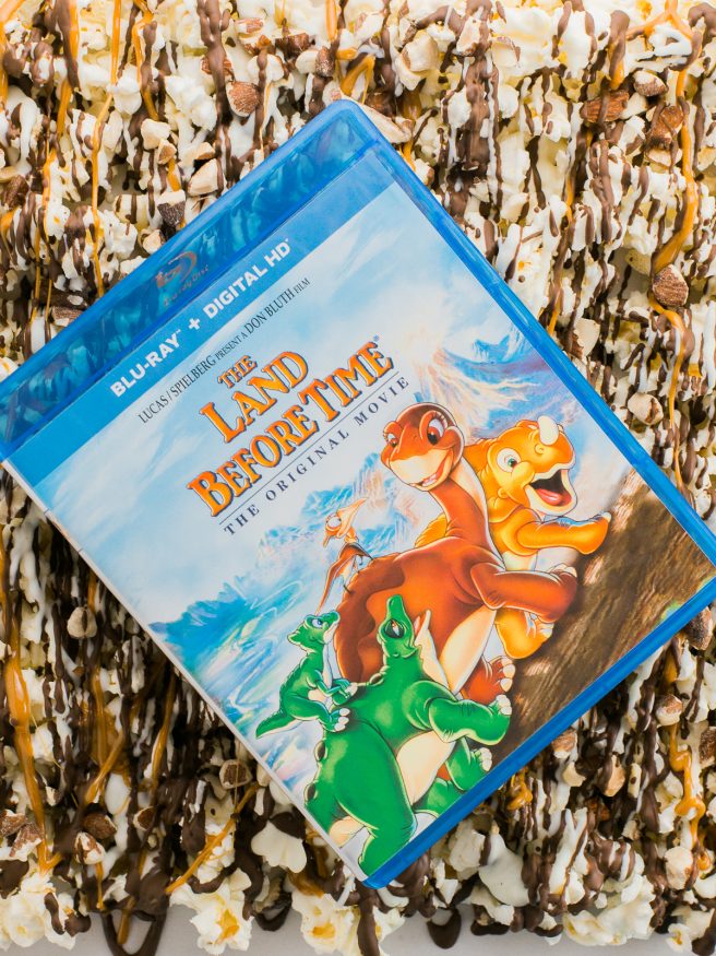 Zebra Popcorn recipe made a perfect companion for our Land Before Time Movie night! Drizzled with dark and white chocolate, caramel and chopped almonds!