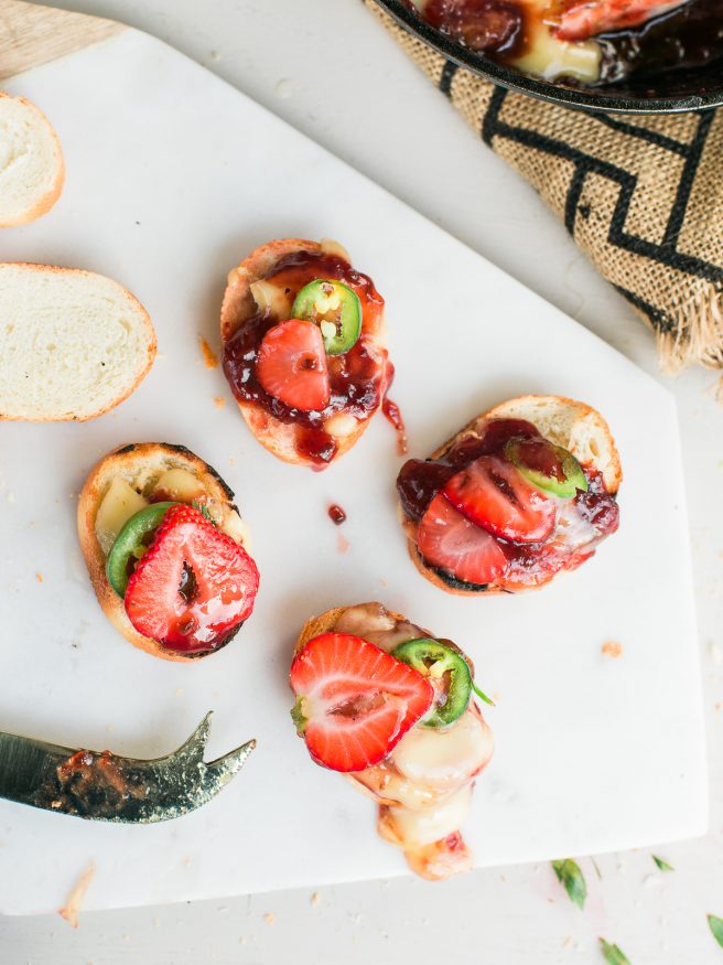 Grilled brie that will make you a hero at home. Grilled with Strawberry and Jalapeno spread makes for a sweet savory and spicy appetizer everyone will love! 