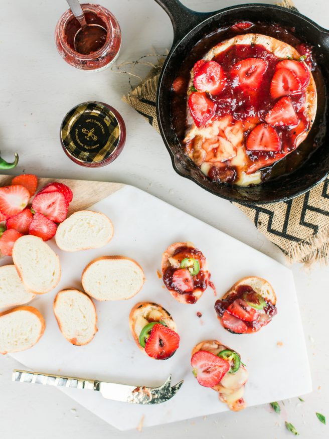 Grilled brie that will make you a hero at home. Grilled with Strawberry and Jalapeno spread makes for a sweet savory and spicy appetizer everyone will love! 