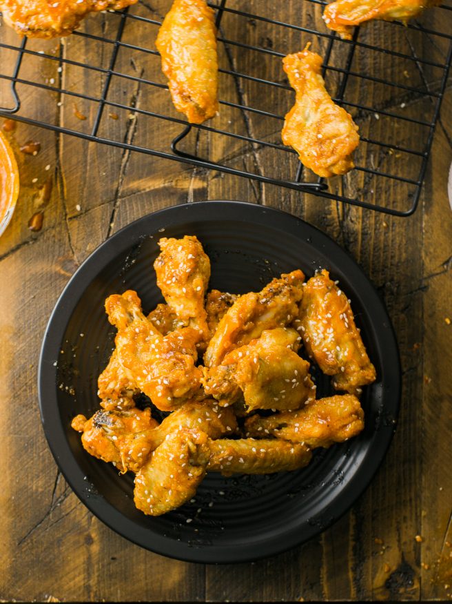 Honey Sriracha Beer Glaze - sounds amazing right? Put it over some crispy baked chicken wings and you have a match made in heaven!