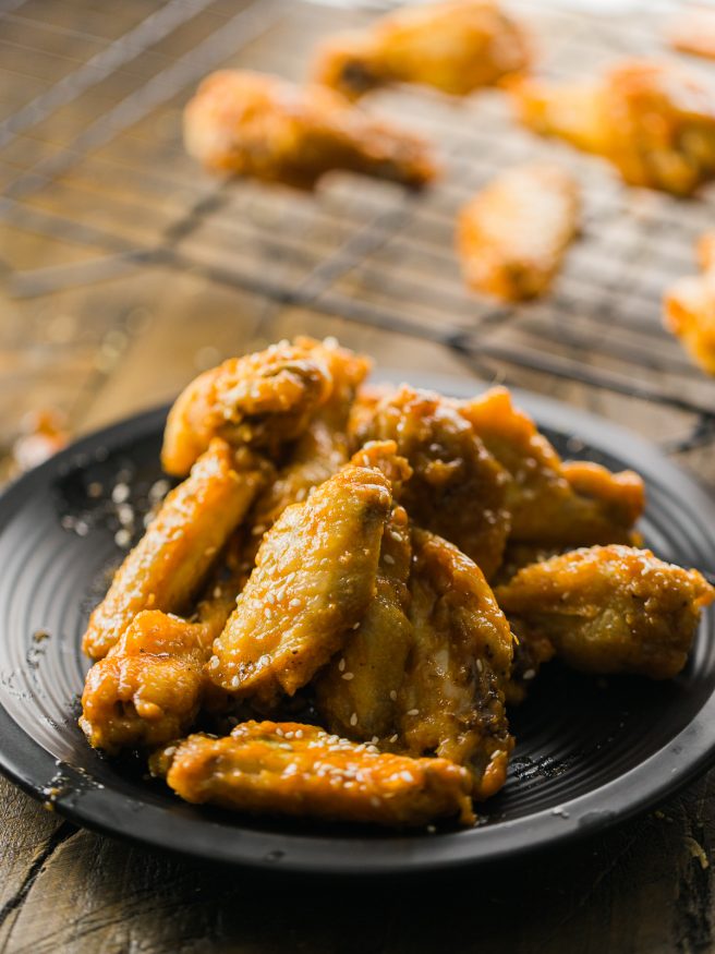 Honey Sriracha Beer Glaze - sounds amazing right? Put it over some crispy baked chicken wings and you have a match made in heaven!