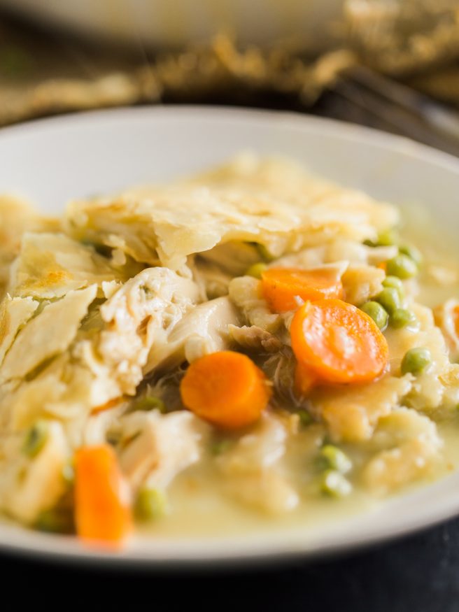 Chicken Pot Pie that's easy to prep. All in one skillet with pre-cooked rotisserie chicken, fresh rosemary, thyme peas and carrots! 