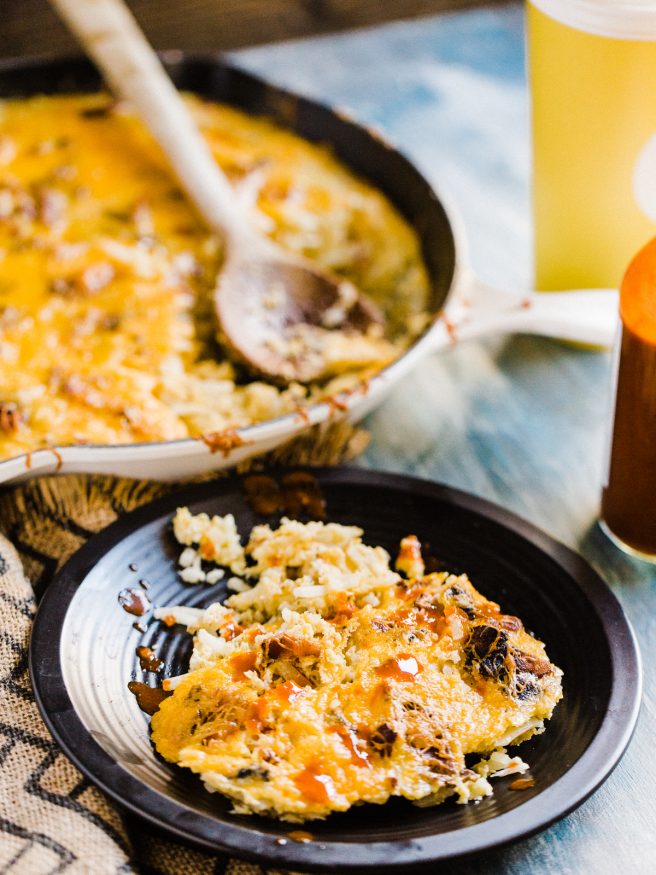 This breakfast skillet is loaded with cheese, bacon, and egg and hash browns. The ultimate casserole to bring to brunch!