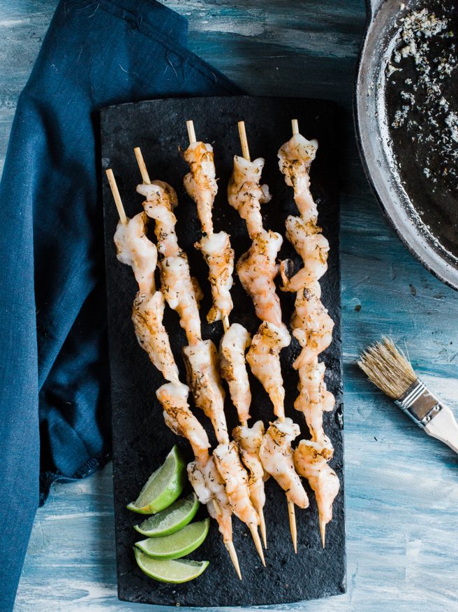 Grilled shrimp recipe with a garlic and herb butter. Insanely easy, delicious and perfect for summer grill outs! 