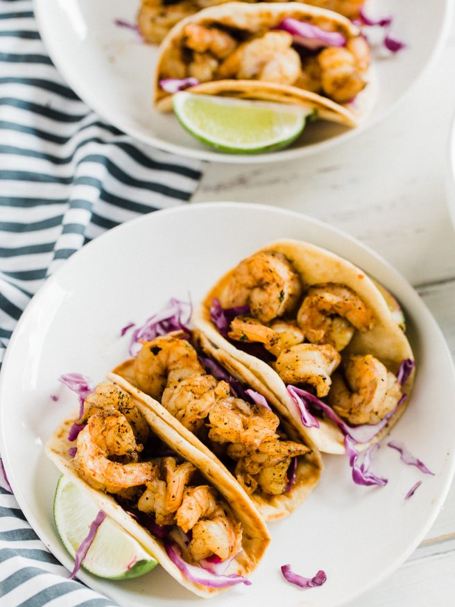 Spicy Shrimp Tacos cooked on the grill, with chili powder, red pepper flakes, cayenne pepper, and other spices. Perfect for the summer!