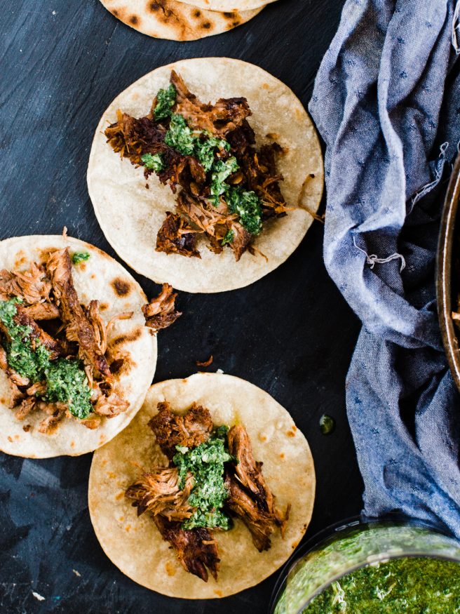 Grilled barbacoa tacos, cooked low and slow with a zesty chimichurri sauce. Barbacoa makes an excellent change to taco Tuesday! dadwithapan.com