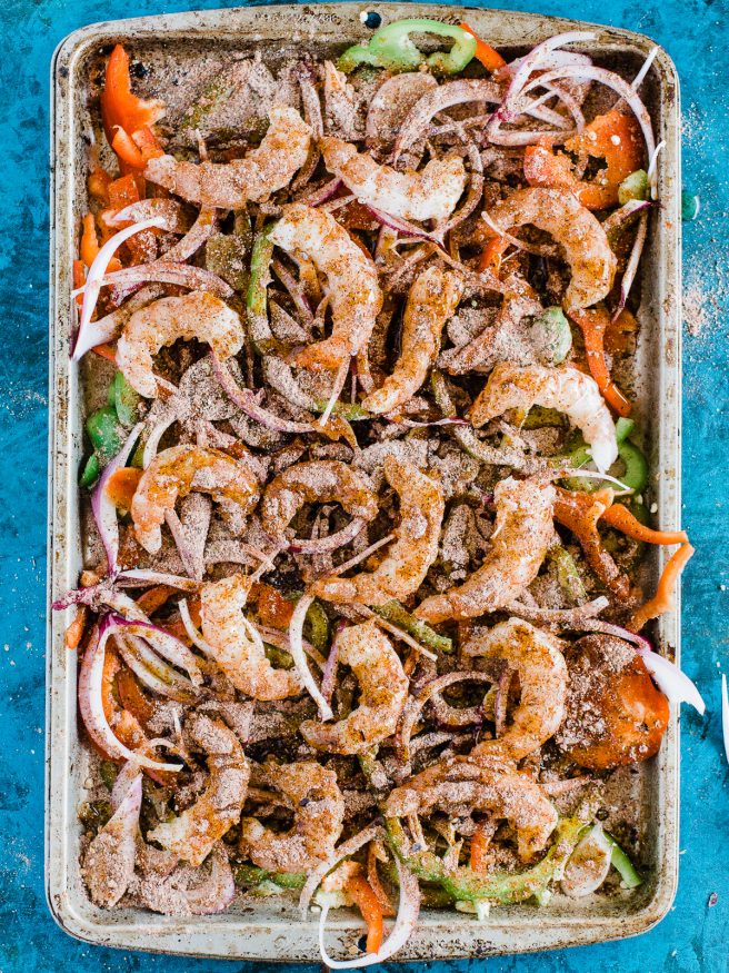 Spicy Shrimp fajitas with a homemade fajita seasoning. Cooked all on one sheet pan making this meal amazingly easy to prepare and cook!