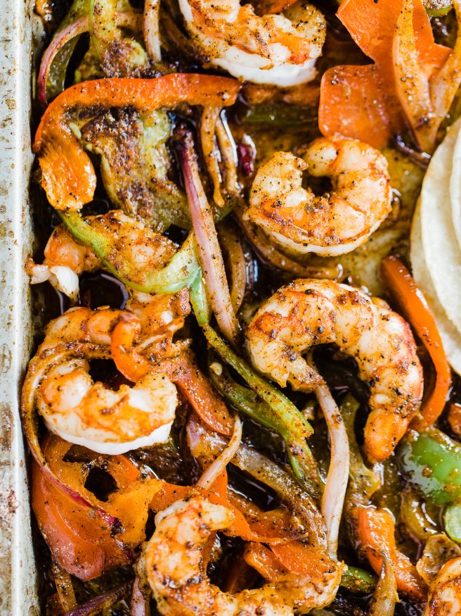 Spicy Shrimp fajitas with a homemade fajita seasoning. Cooked all on one sheet pan making this meal amazingly easy to prepare and cook!