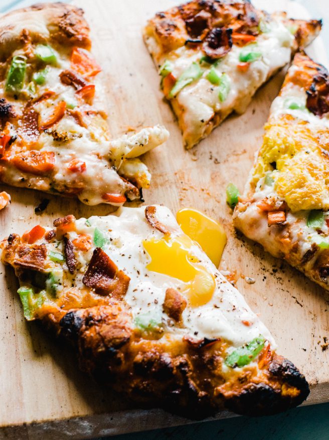 Breakfast Pizza meets Denver omelette. Topped with egg, bacon, bell peppers and cheese. A great way to start the weekend is with a breakfast pizza! 