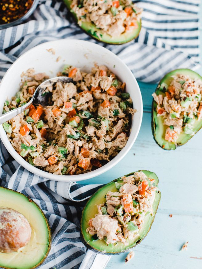 Tuna Salad Avocado Boat with a red pepper flakes to add some heat. Fresh vegetables with a little Dijon mustard and mayonnaise mixed with tuna. Delicious!