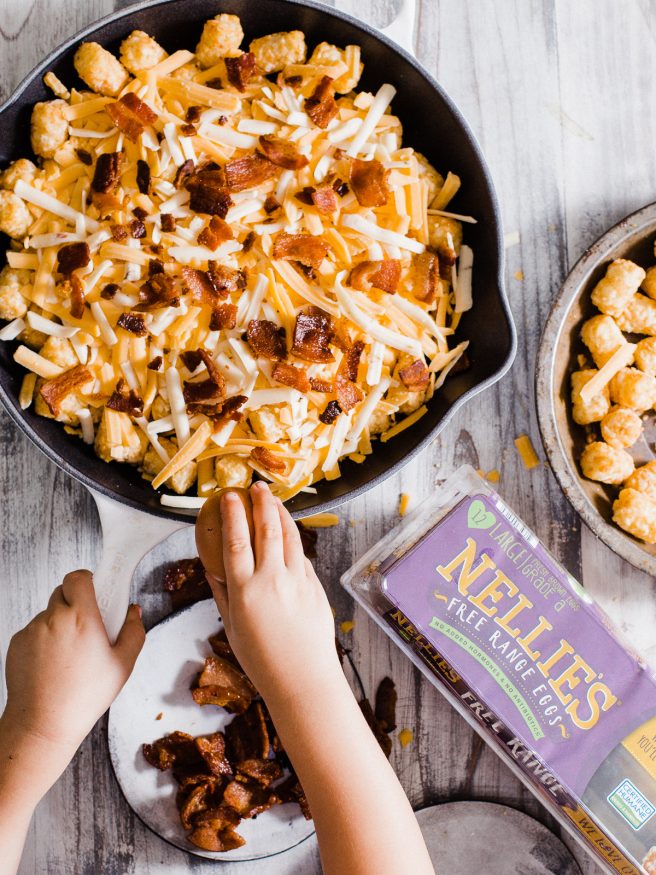 Making an easy breakfast dish with with Bacon Egg and Cheese Totchos. This makes the perfect candidate for a breakfast to cook up with the kids! 