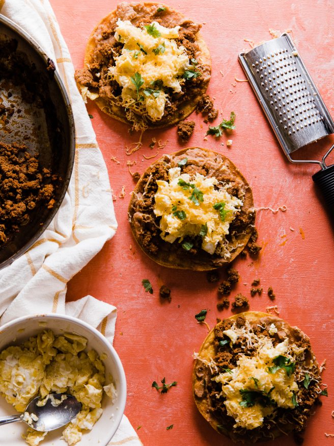 This Breakfast Tostada is loaded up with chorizo seasoned turkey, refried beans, scrambled eggs and cheese. The perfect way to start the day. SUPER EASY TO MAKE!