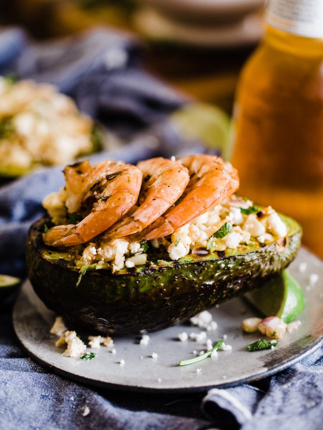 Grilled Avocado Bowl with Elote cut off the cob and topped with some grilled shrimp. This makes a great side dish or light lunch! 