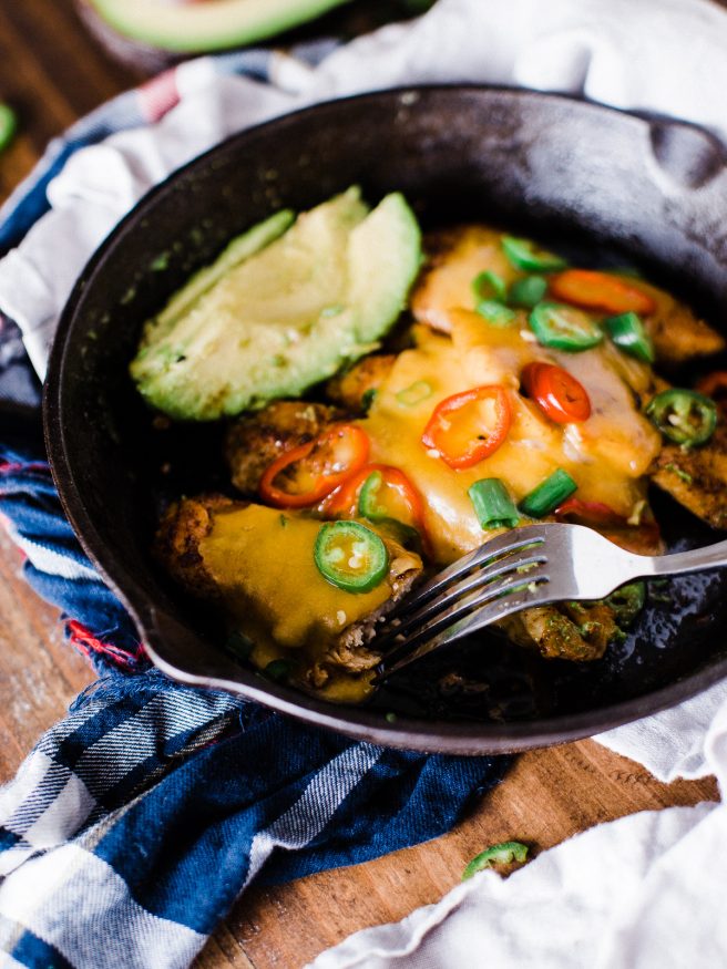 Spicy Skillet Chicken Tenders flambeed in tequila. Makes a great quick dinner, full of heat from fresno and serrano peppers and loaded with melted cheese on top! 