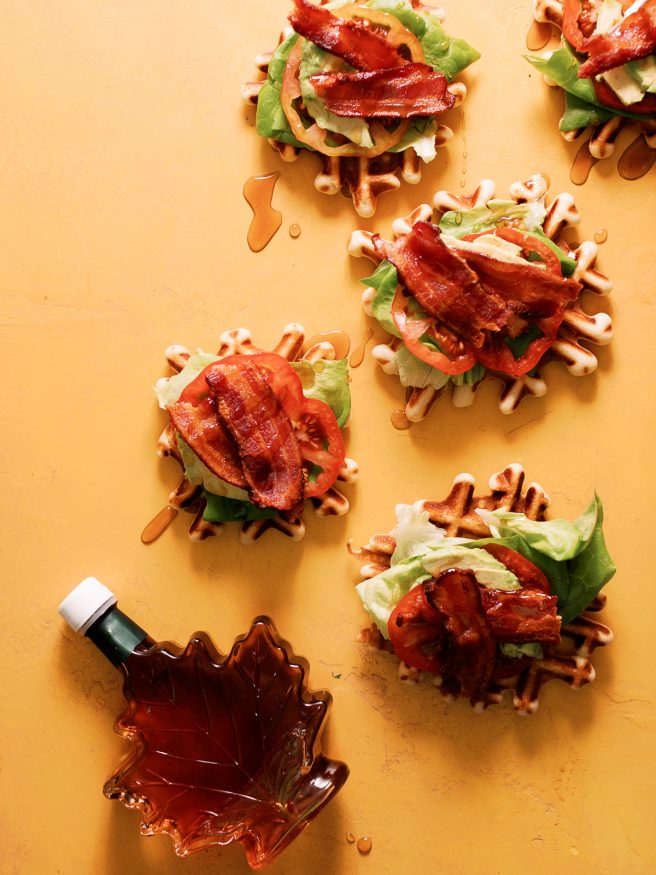 BLT Waffles bites combine the best of both worlds. Smothered with maple syrup to make this an awesome way to enjoy your next game day!