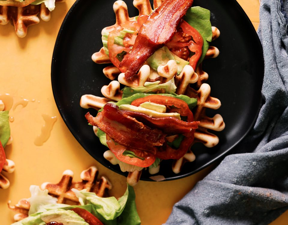 BLT Waffles bites combine the best of both worlds. Smothered with maple syrup to make this an awesome way to enjoy your next game day!