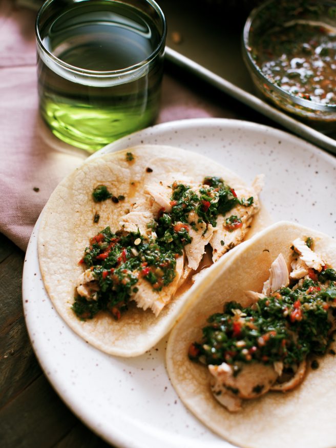 Chimichurri spatchcock chicken cooked on a wood fire grill. Tons of bold, zesty flavors and is a great weekend dinner idea