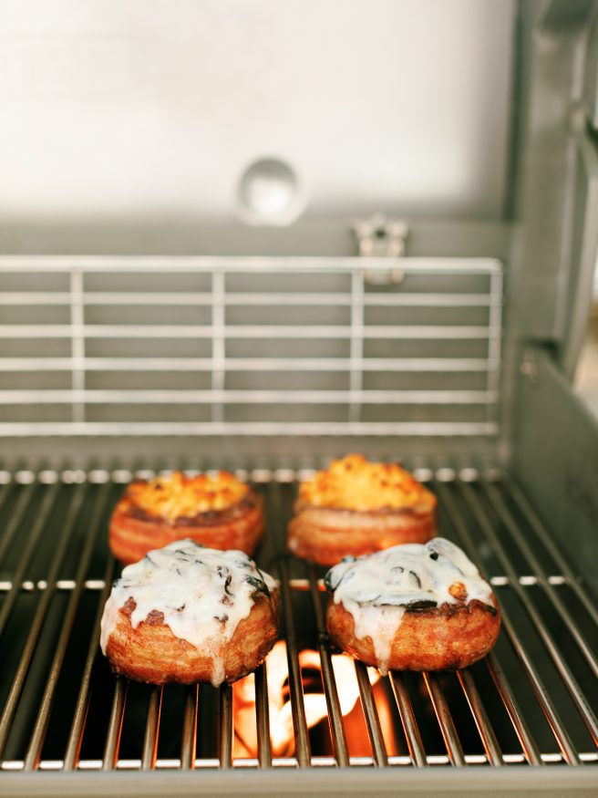 Bacon Wrapped Soda Can Burgers filled with Mac an Cheese for the kids, and grilled onion and mushroom with swiss for the adults! 