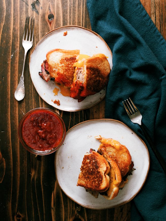 Smoky slices of brisket flat in between cheese and bread, to make a brisket grilled cheese sandwich that's a perfect use of leftover brisket!!