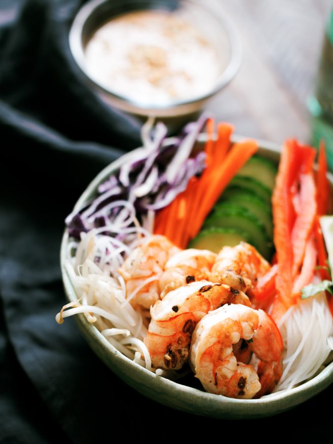 This spring roll bowl has grilled shrimp, rice stick noodles, and fresh veggies topped with a peanut sauce. Much easier to make than actual spring rolls!