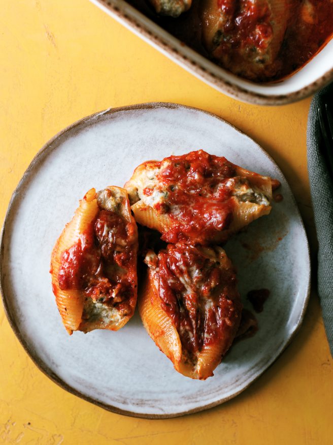 Lasagna stuffed shells with ground beef, ricotta and Italian seasonings, topped with mozzarella and can be made ahead of time!