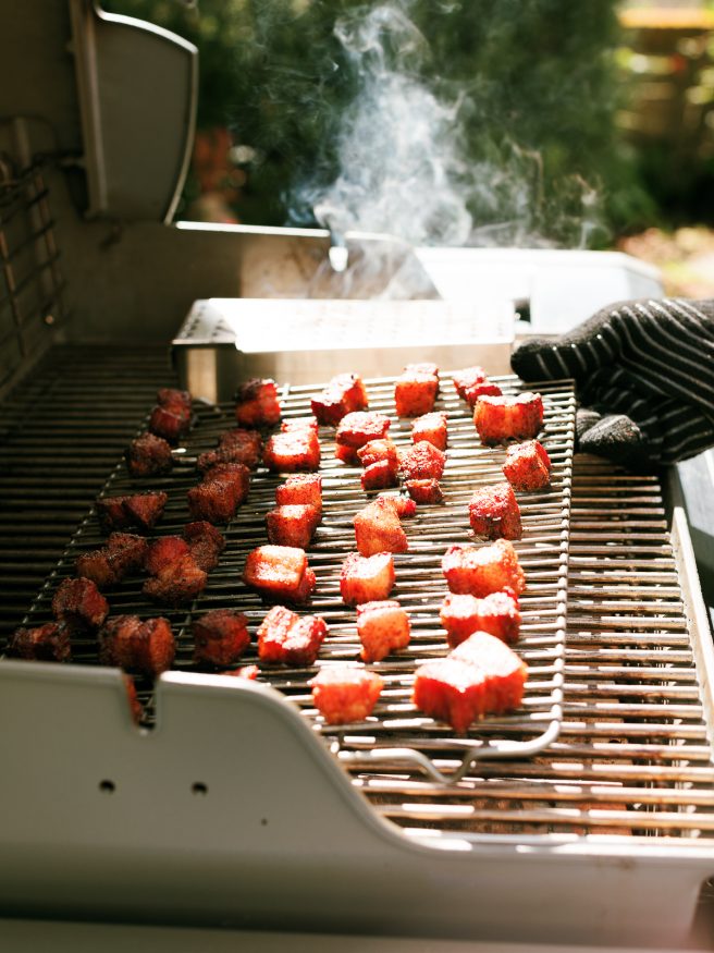 Smoked Pork Belly Burnt Ends cooked low and slow with hickory and apple wood. Finished off with honey and barbecue sauce for tender little morsels of meat candy