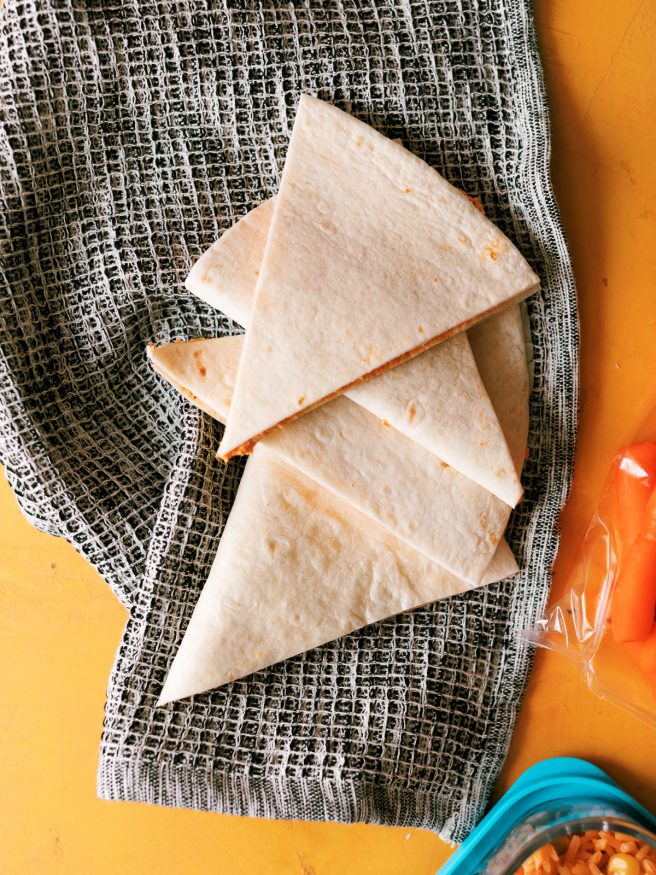 Figuring out an easy back to school lunch for kids in different phases is a little tricky. I think I’ve nailed it with these chicken enchilada snackers that both of my kids love! 