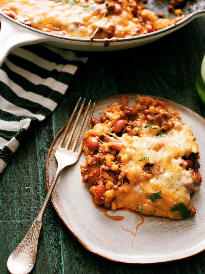 Tamale Pie is perfect comfort food! Ground beef beans,fire roasted corn with a taco seasoning, on top of cornbread and loaded with cheese.