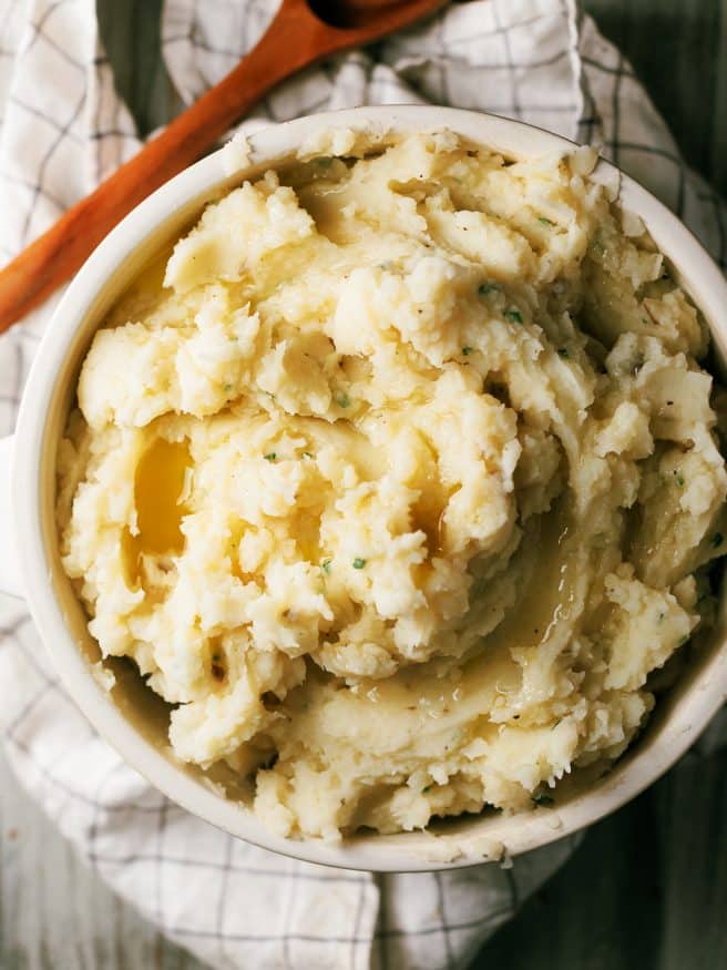 Classic mashed potatoes with a garlic infused butter and fresh chopped chives. Amazing flavor and texture that will make you think your mother made it!