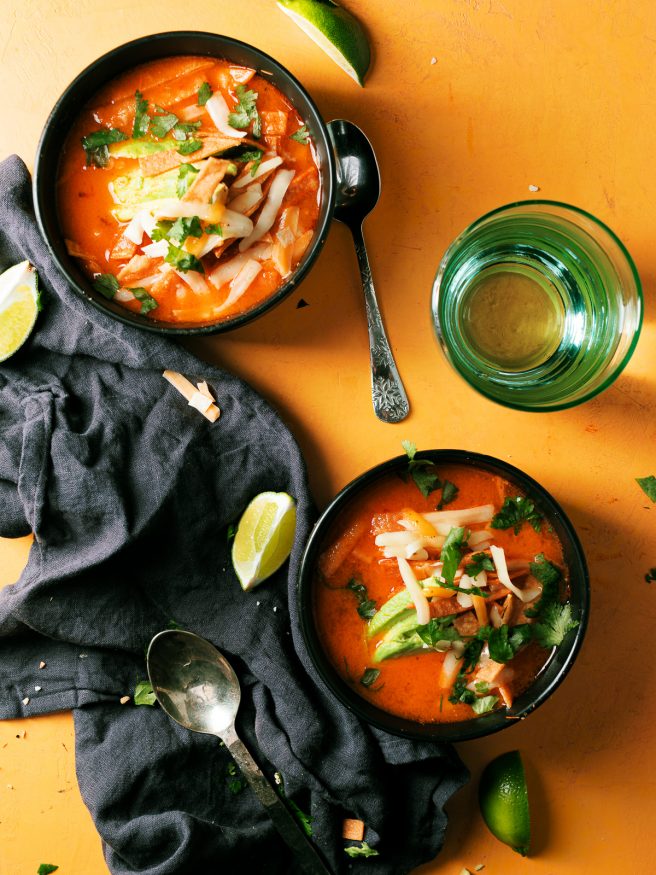 Smoked tomato onion and jalapenos to add a beautiful smoky flavor to this chicken tortilla soup that is comfort food at its best!
