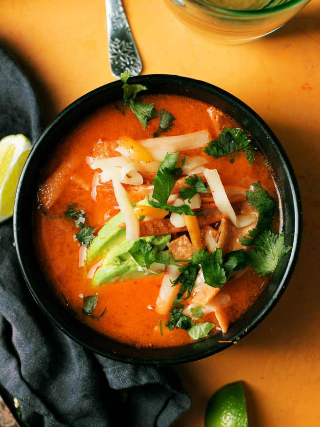 Smoked tomato onion and jalapenos to add a beautiful smoky flavor to this chicken tortilla soup that is comfort food at its best!
