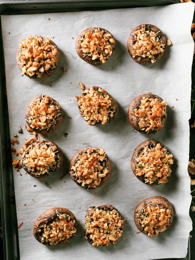 These walnut and rosemary stuffed mushrooms are the perfect appetizer to put together for the holidays. Comes together in 15 minutes!