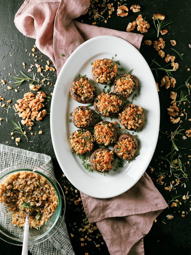 These walnut and rosemary stuffed mushrooms are the perfect appetizer to put together for the holidays. Comes together in 15 minutes!