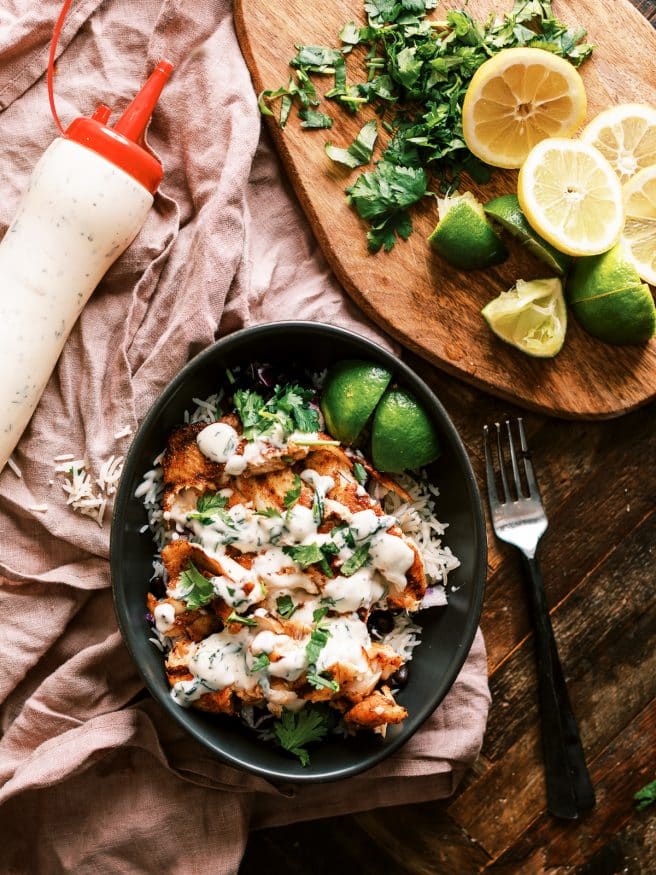 This grilled fish taco bowl is perfect for a weeknight. Beautiful fresh tilapia filets rubbed in a few simple spices, then topped with a cilantro aioli. 