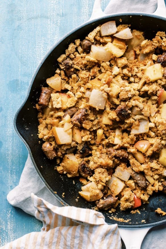 Breakfast Stuffing Acorn Squash loaded with maple sausage, pears and apples, and with a sweet maply syrup infused stuffing. 