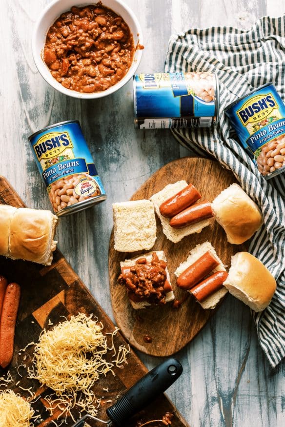 Easy weeknight chili dog sliders with from scratch 30 minute chili recipe. Perfect game day recipe or fun weeknight dinner!
