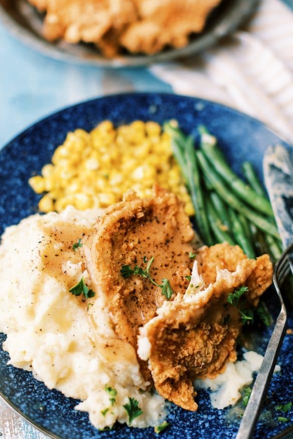 country fried chicken in a seasoned breading that is perfect for a homestyle comfort meal. Thin chicken fried until crispy and golden!