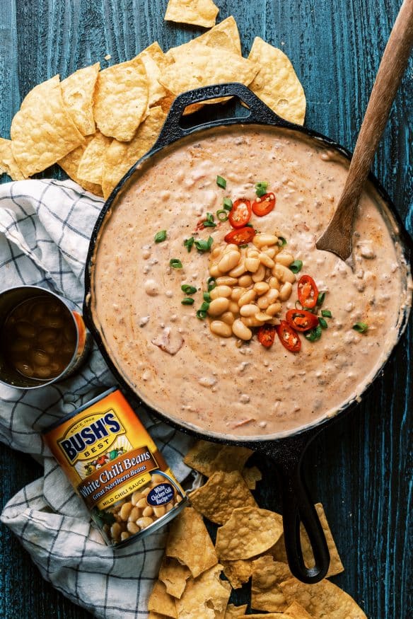 This white bean queso dip is loaded with all sorts of goodness. White Chili Beans , ground beef and all sorts of cheese. It’s got tailgating vibes all over it!  