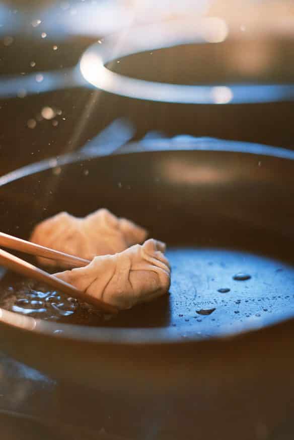 Fried Pork dumplings with a delicious pork filling with ginger, soy sauce rice vinegar, scallions and cabbage and from scratch dough.