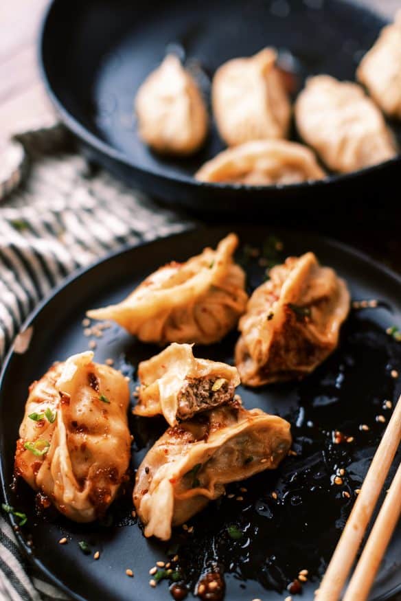 Fried Pork dumplings with a delicious pork filling with ginger, soy sauce rice vinegar, scallions and cabbage and from scratch dough.