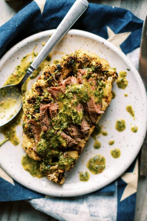 grilled chimichurri cauliflower with a quick chimichurri sauce, marinated cauliflower, then grilled. Perfect keto side!