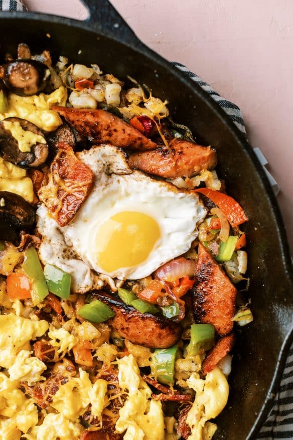 Country Style Breakfast Skillet, with over easy, scrambled and plant based egg, along with different meats and veggies for Mom, Dad and the kids!
