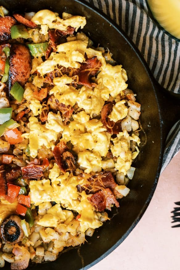 Country Style Breakfast Skillet, with over easy, scrambled and plant based egg, along with different meats and veggies for Mom, Dad and the kids!
